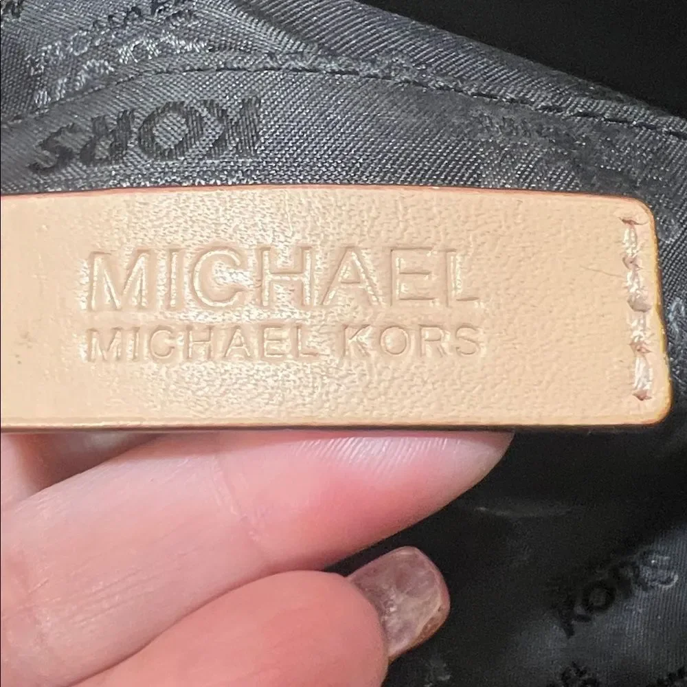 Michael Kors Jet Set Chain Tote in black patent leather with gold hardware.